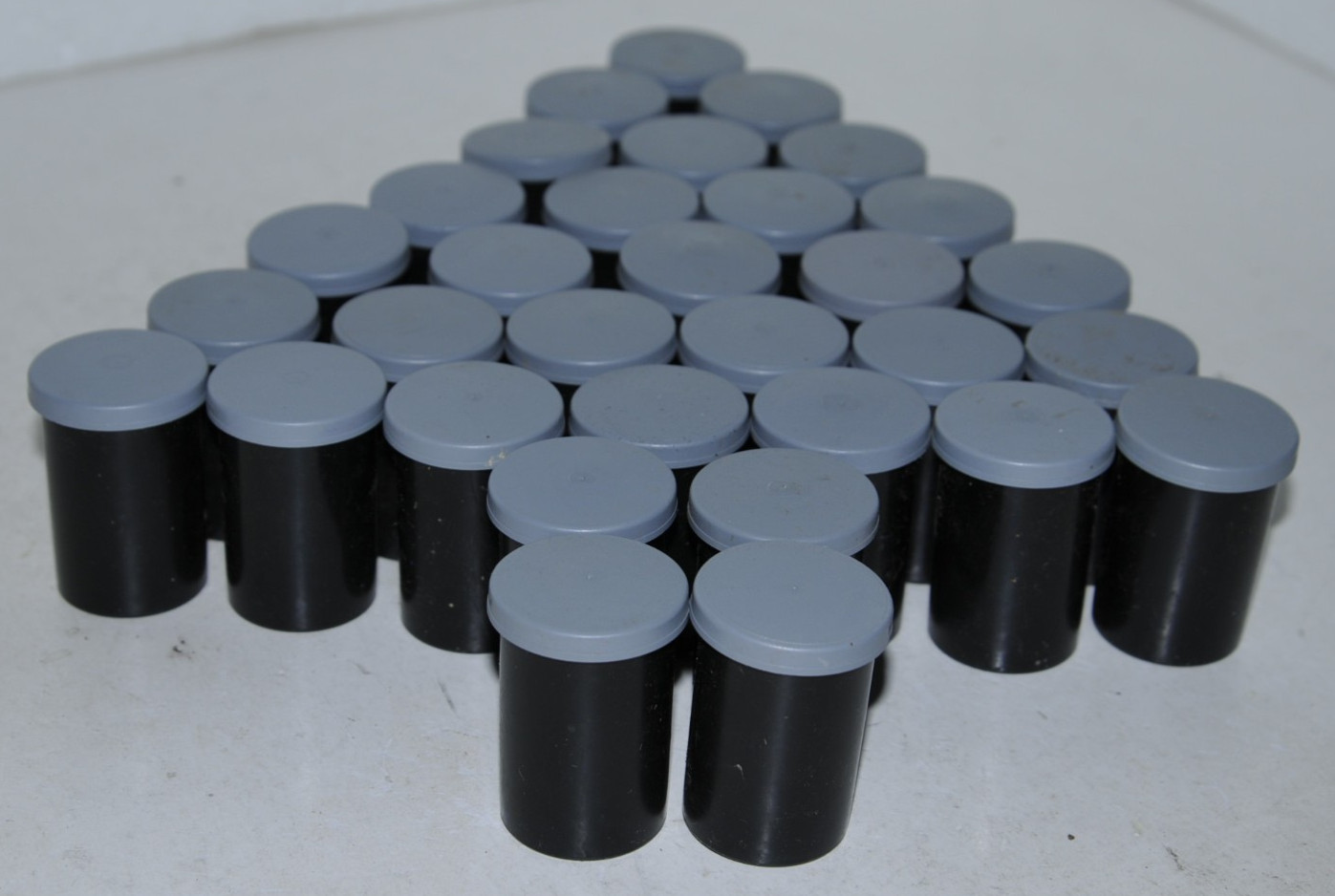 32 Kodak black plastic 35mm film canisters w/ gray caps #15