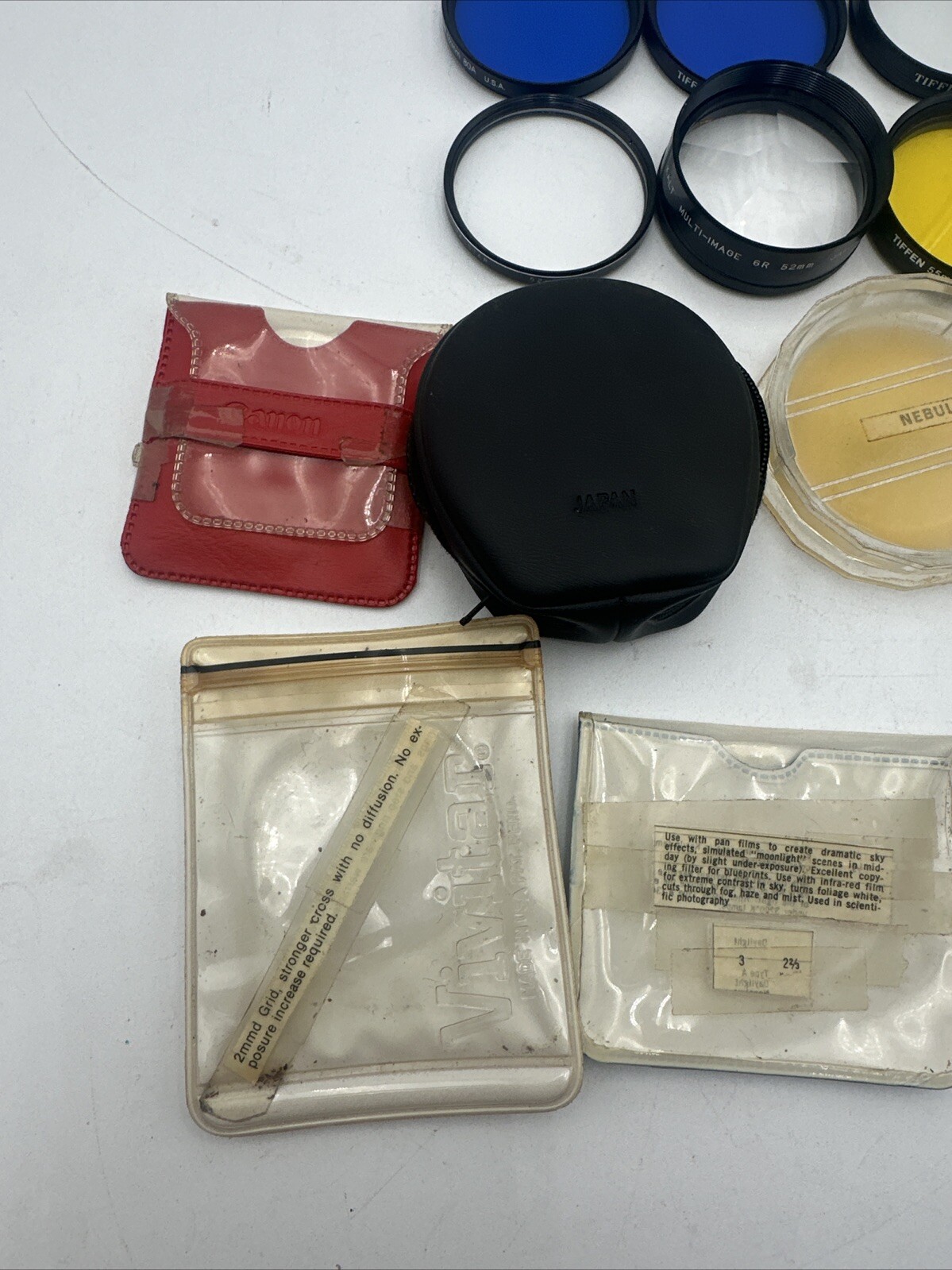 Lot of 7 Vintage Tiffen, Kalt, Canon Filters W/ Cases