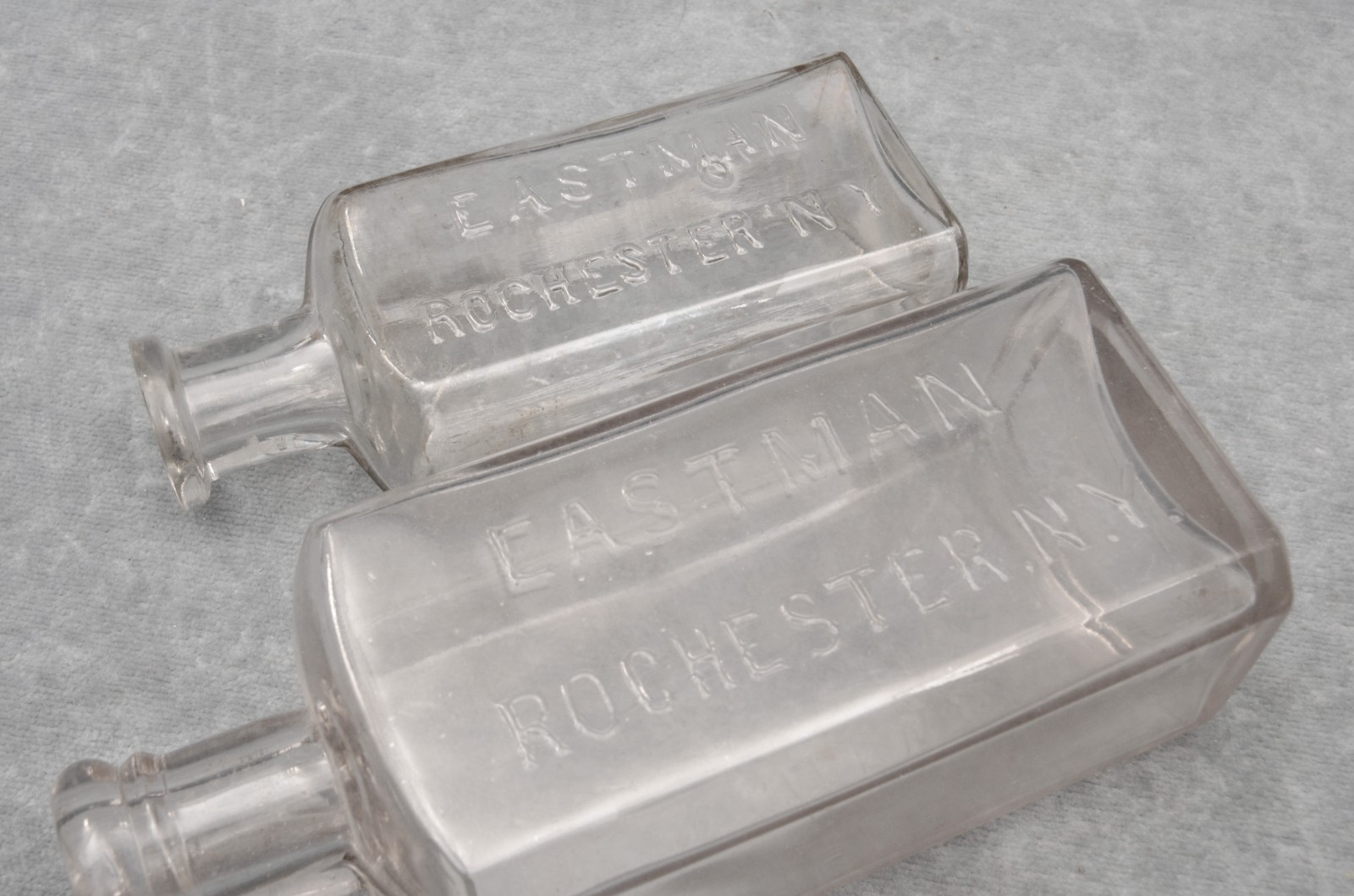 PAIR OF ANTIQUE EASTMAN (KODAK) GLASS CHEMICAL BOTTLES