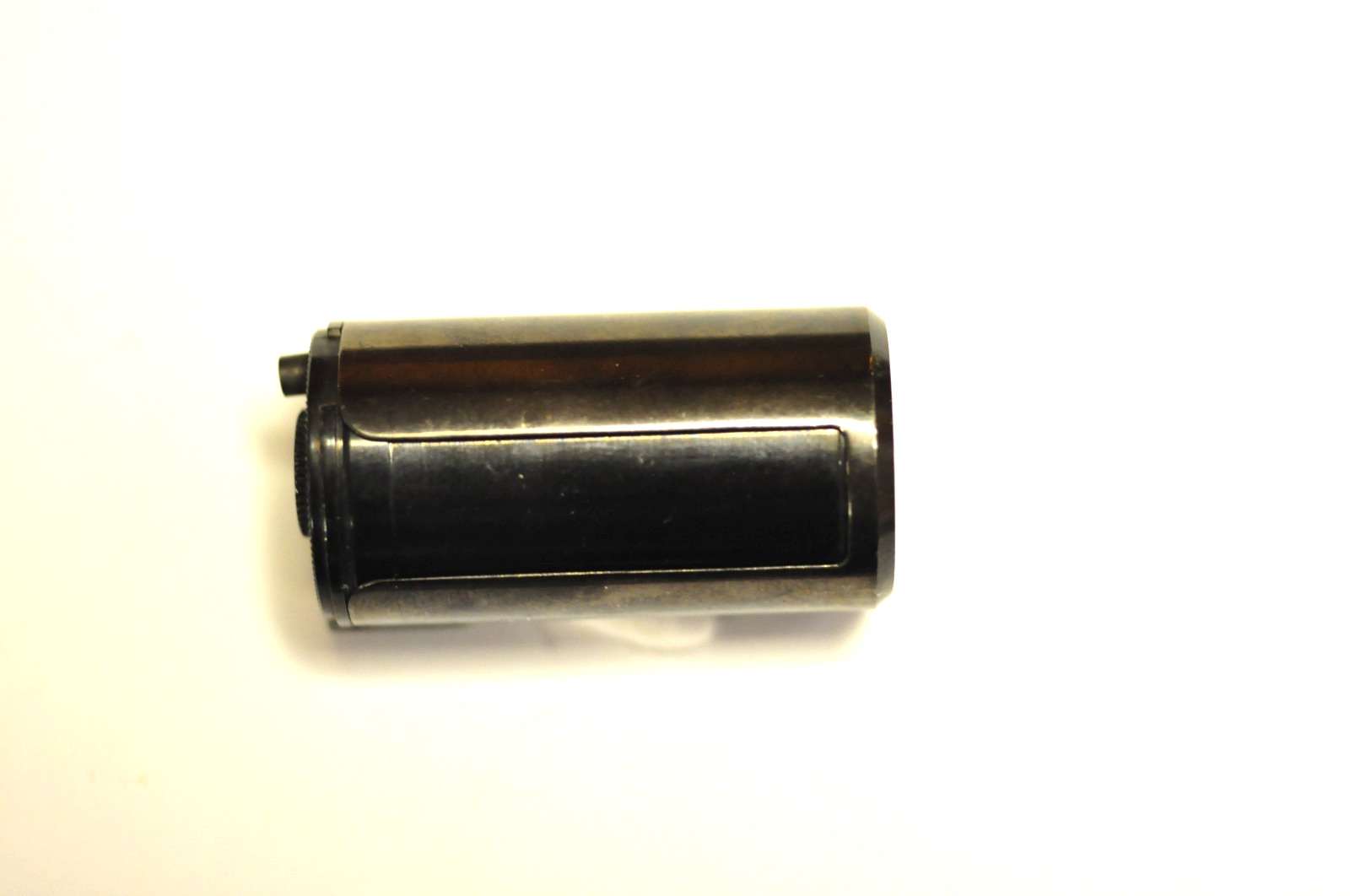 Canon 35mm reloadable film cassette as shown.
