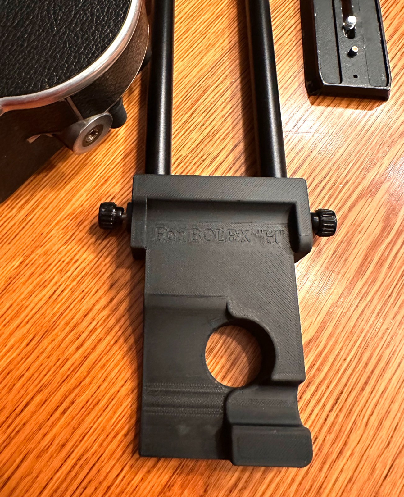 Bolex Saddle for 15mm Rods 60mm on Center – for “REX1 2 or 3” Round Base Cameras