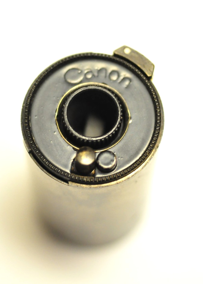 Canon 35mm reloadable film cassette as shown.
