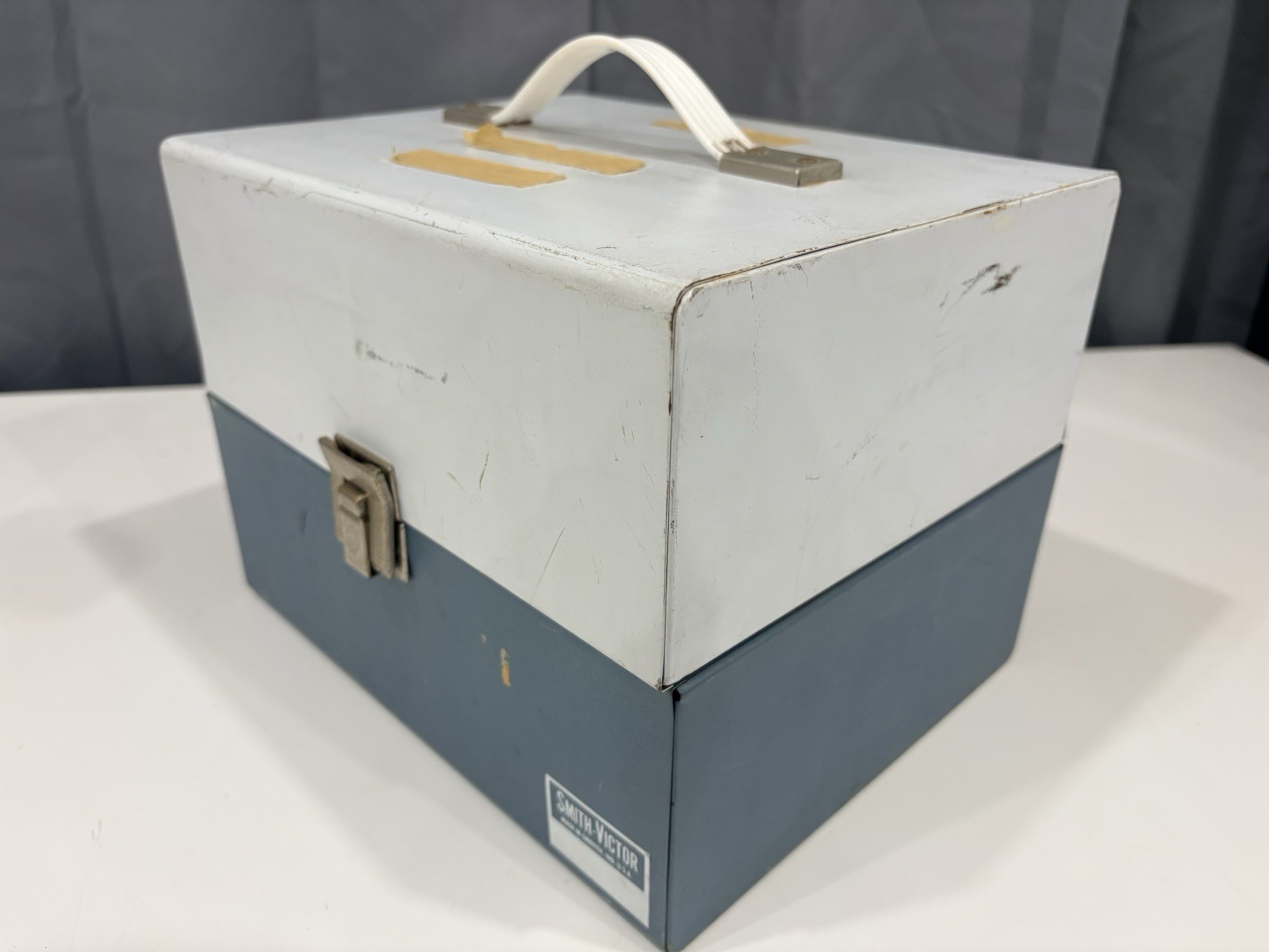 13 vintage 8mm film reels with 12 canisters and carrying case. No Film.