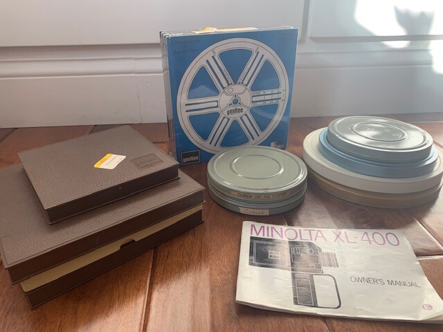 Lot of Vintage 7 Inch 8mm Metal and Plastic Film Reels, Cans, and Movies