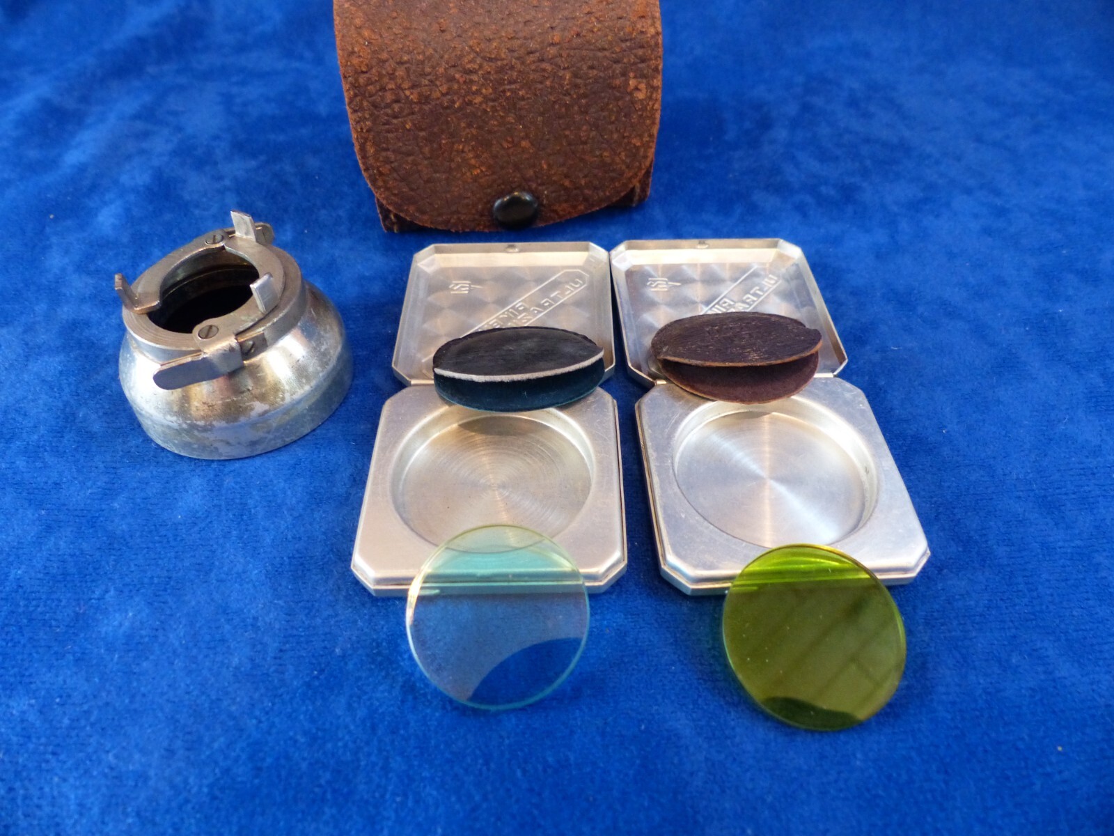 Vintage Riken 25 mm filters in metal cases+clamp-on lens hood in leather case