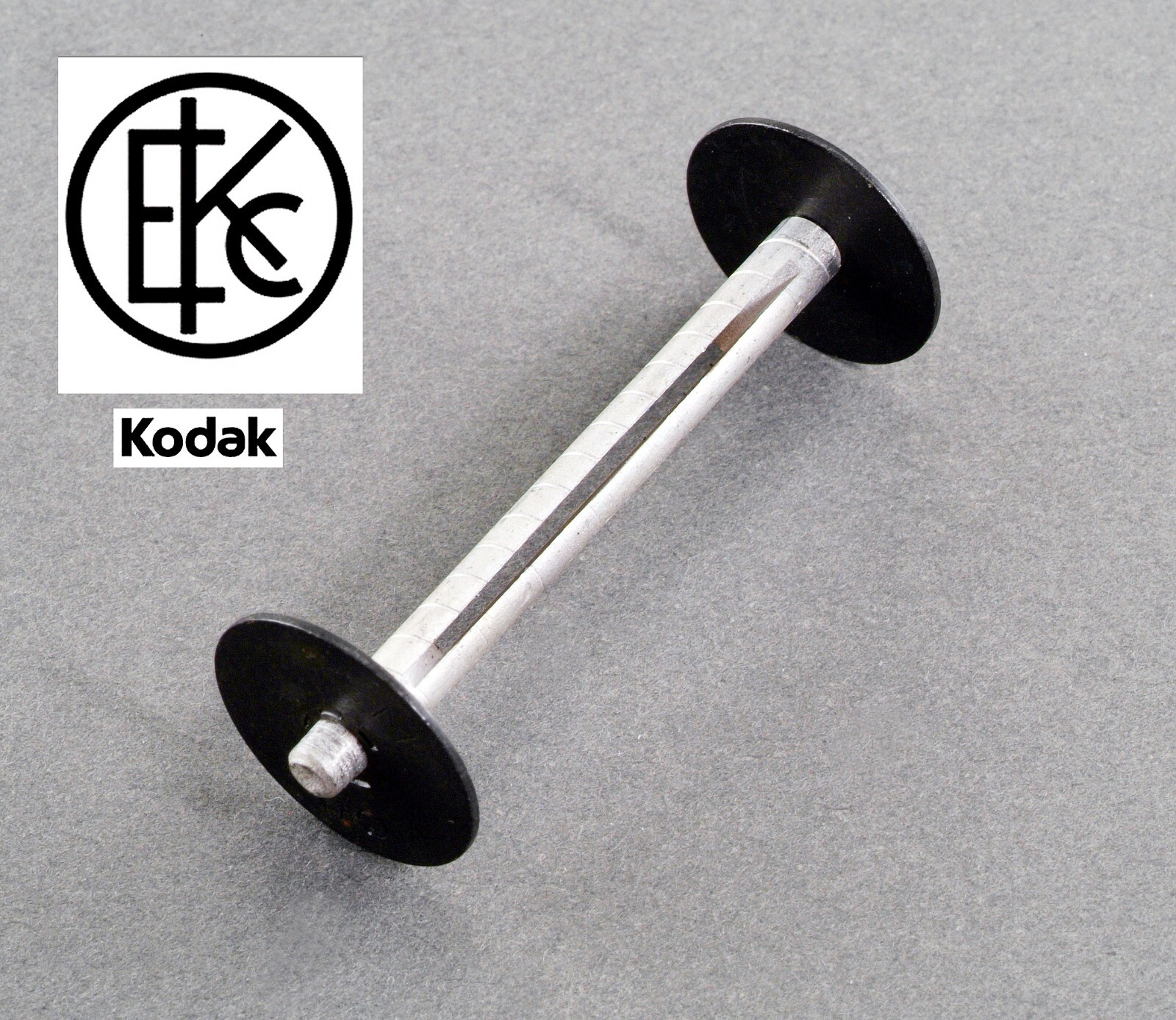 VINTAGE KODAK 127 TAKE UP SPOOL IN BLACK & SILVER WITH LOGO.