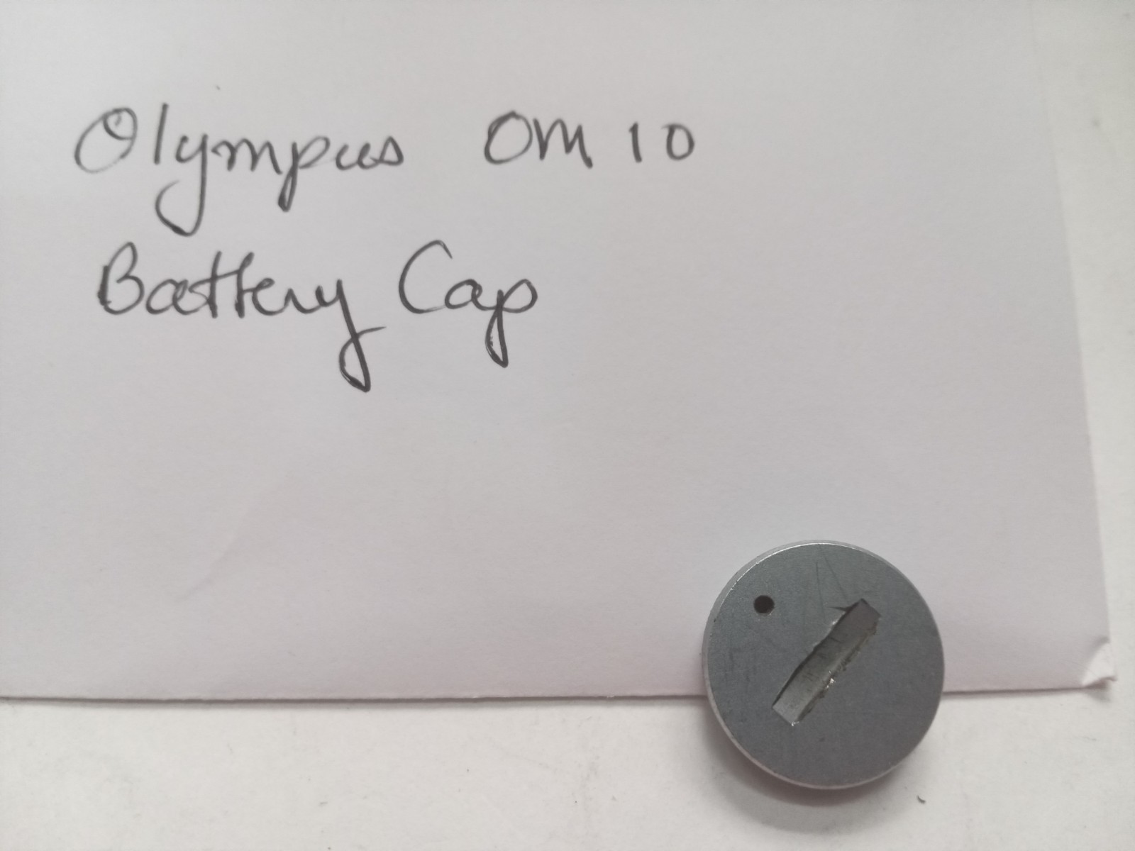 Olympus OM 10 Film SLR Camera Battery Cap Original Used Spare Part