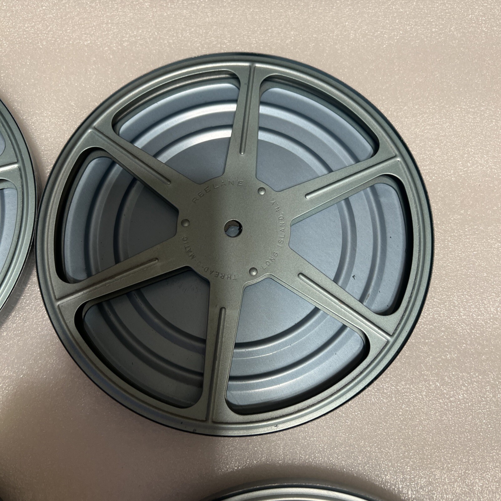 Reelane Thread-O-Matic 7” Film Reel with Canister Lot
