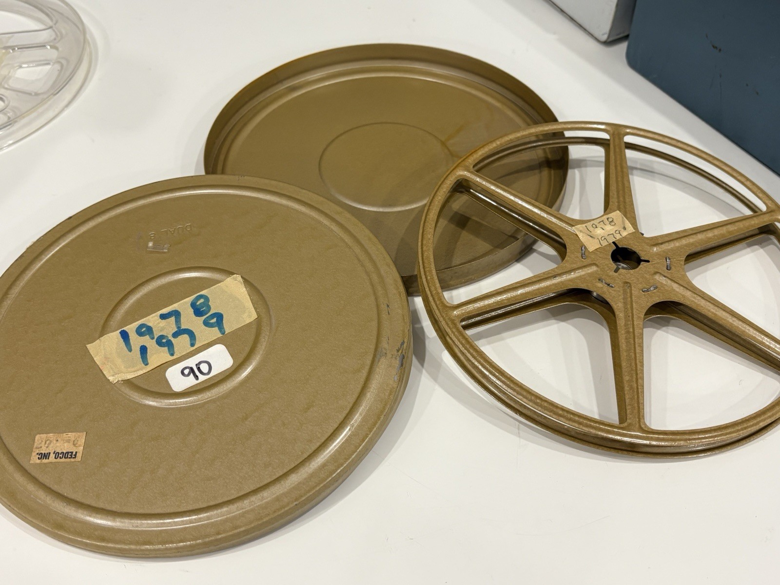 13 vintage 8mm film reels with 12 canisters and carrying case. No Film.