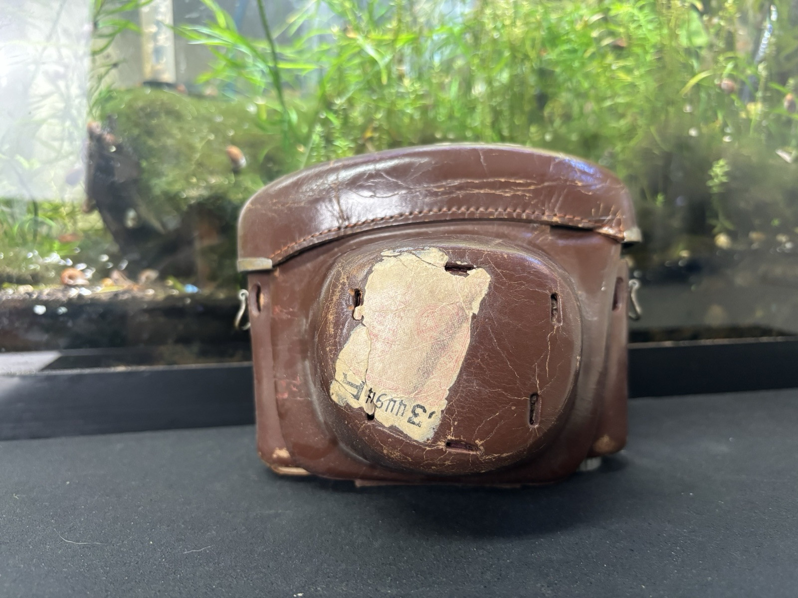 Vintage Brown Film Camera Case Made in Japan lots of wear and rust on metal.