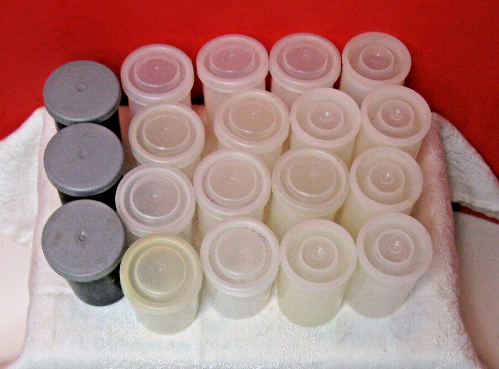 19 Film Cannisters; Five tall white, 12 shorter white, three grey.