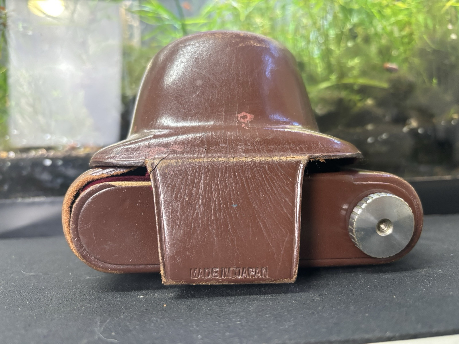 Vintage Brown Film Camera Case Made in Japan lots of wear and rust on metal.