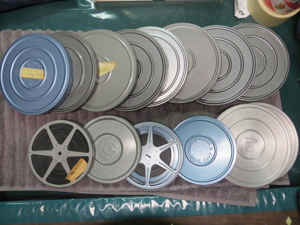 Brumberger 8mm reel case W/ 12 mint take up reels & vintage films