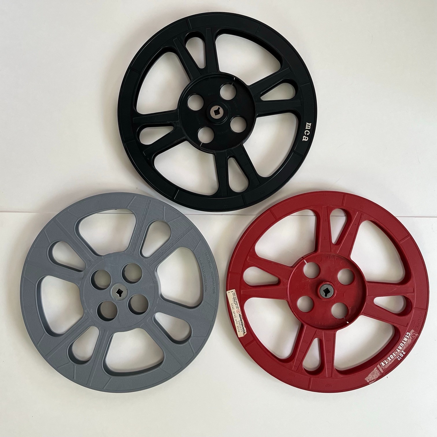 Assorted empty 1200′ 16mm Film Reels (3) and Canisters (4) incl. Fox / M*A*S*H