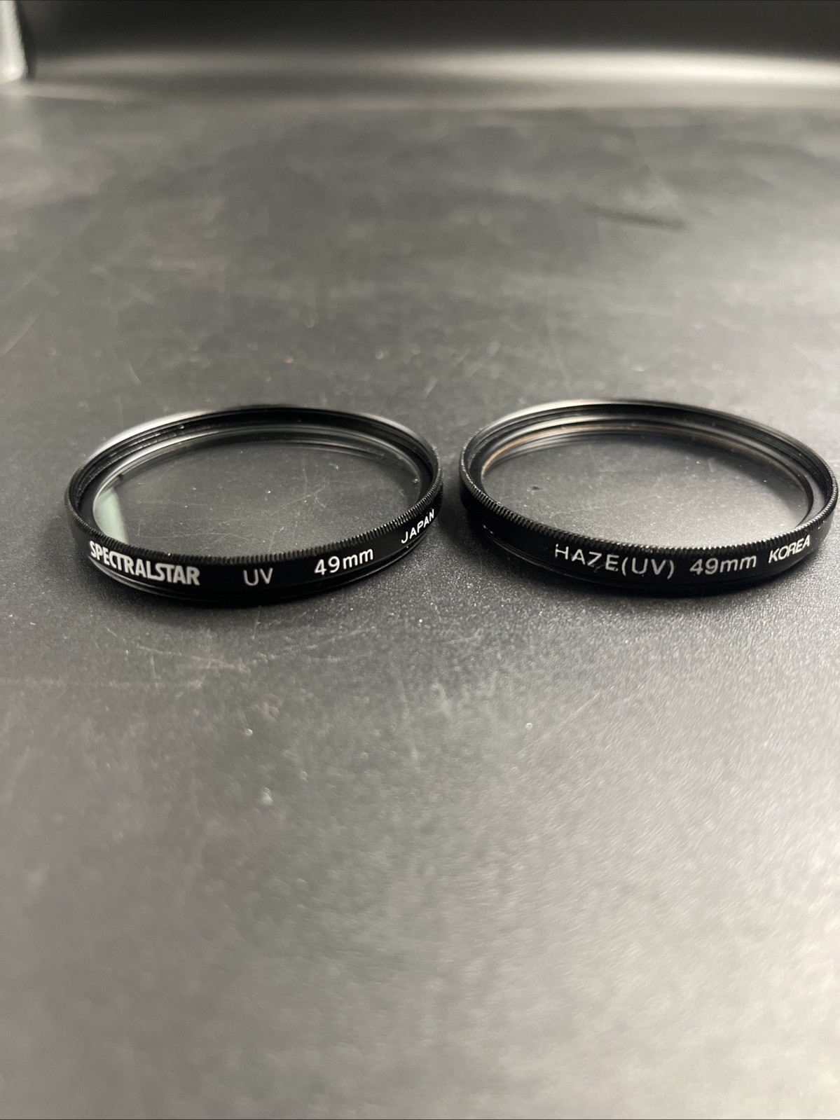 2 VINTAGE 49MM UV SCREW-ON LENS FILTERS – SPECTRALSTAR (JAPAN) & HAZE (KOREA)