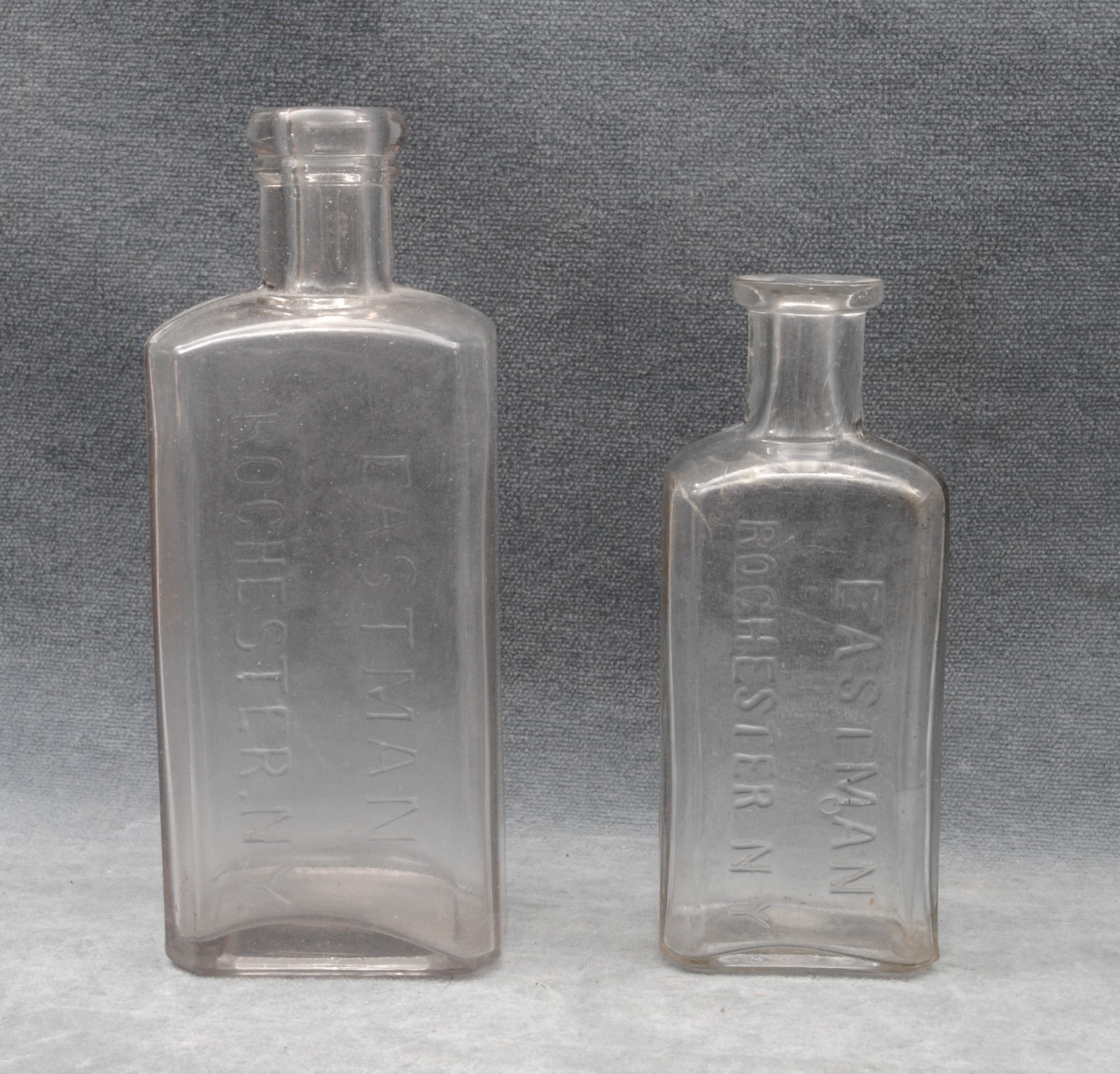 PAIR OF ANTIQUE EASTMAN (KODAK) GLASS CHEMICAL BOTTLES
