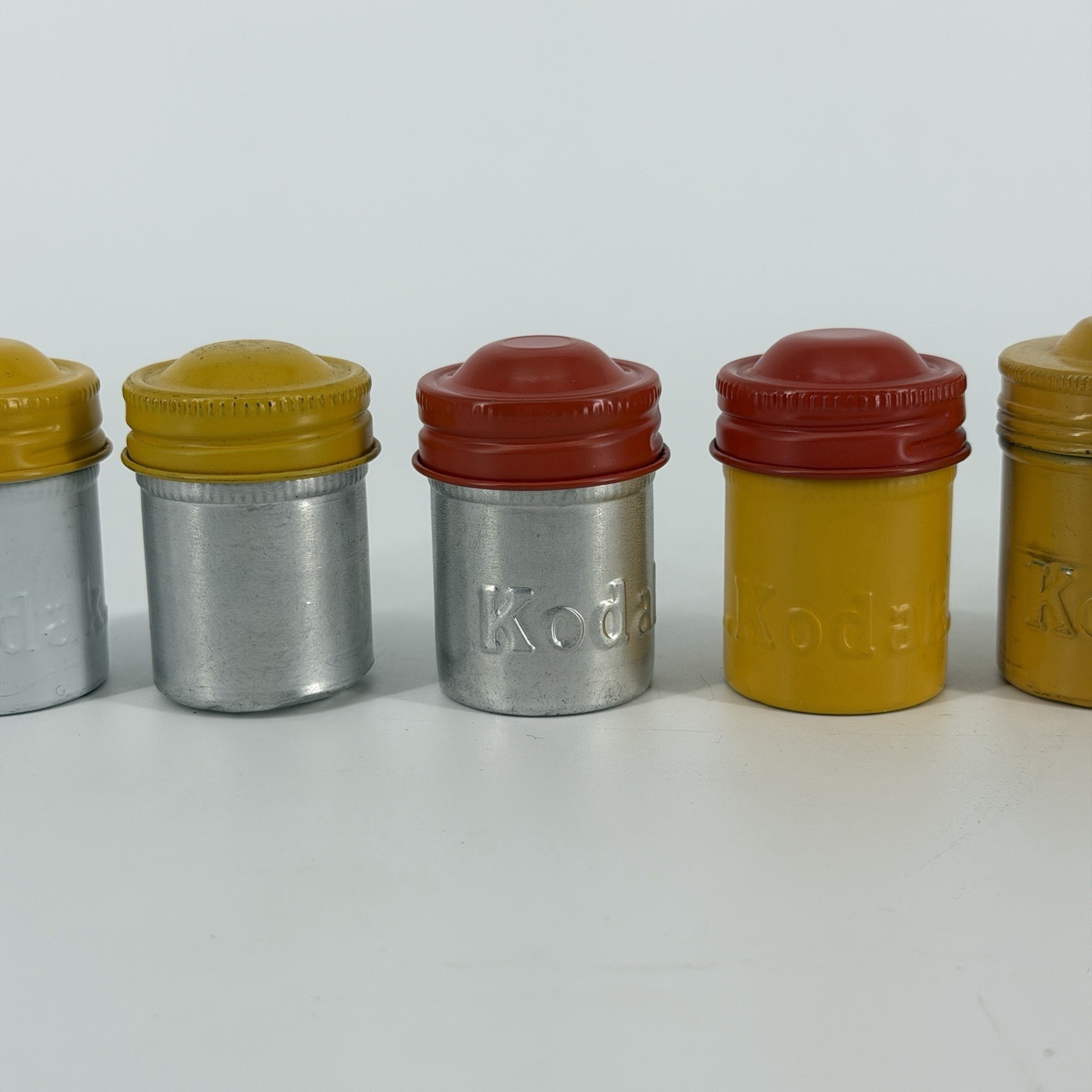 Lot of 7 Vintage Metal Kodak 35mm Film Canisters Yellow, Red, Silver