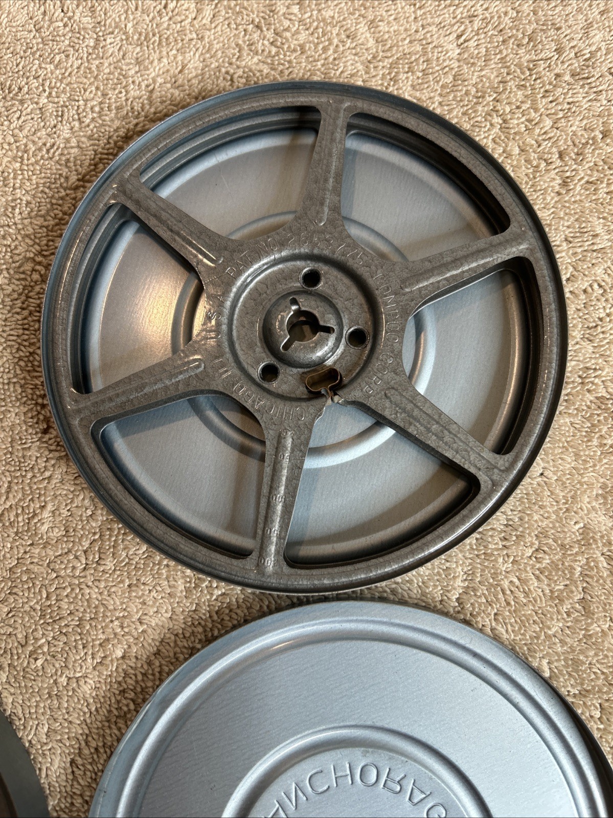 Two Vintage Stewart’s Anchorage Film Canisters In Grey With Mixed Reels 100-R07