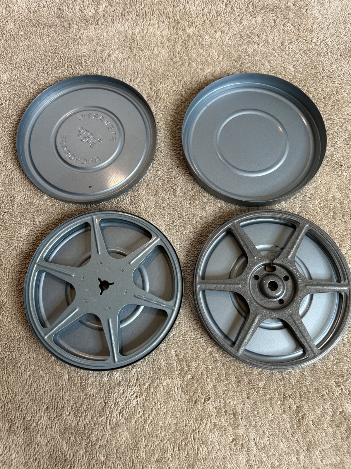 Two Vintage Stewart’s Anchorage Film Canisters In Grey With Mixed Reels 100-R07