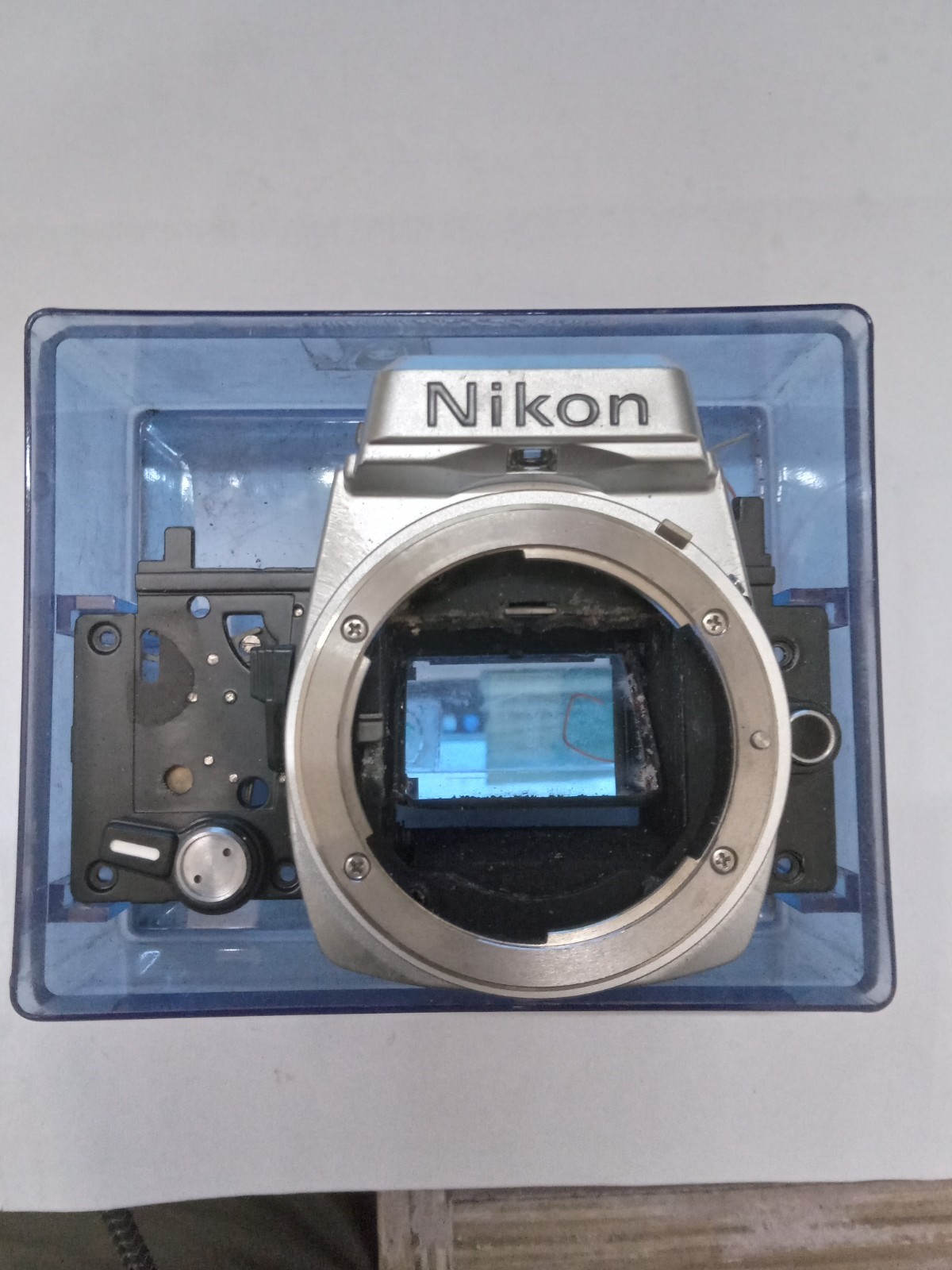 New Old Stock Silver / Chrome Nikon FE Front Bezel W Mirror Spare Part
