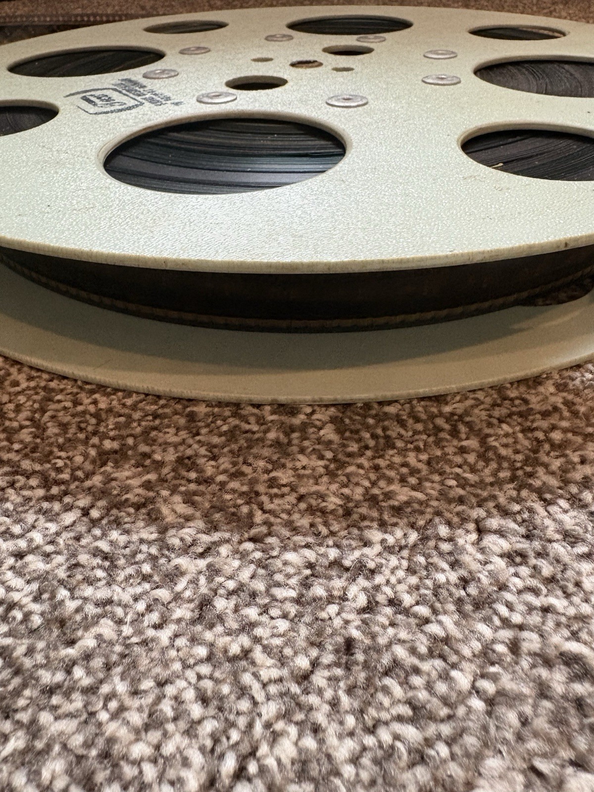 VINTAGE – 15 INCH REWIND FILM REEL – WITH MYSTERY FILM STILL ON – USED