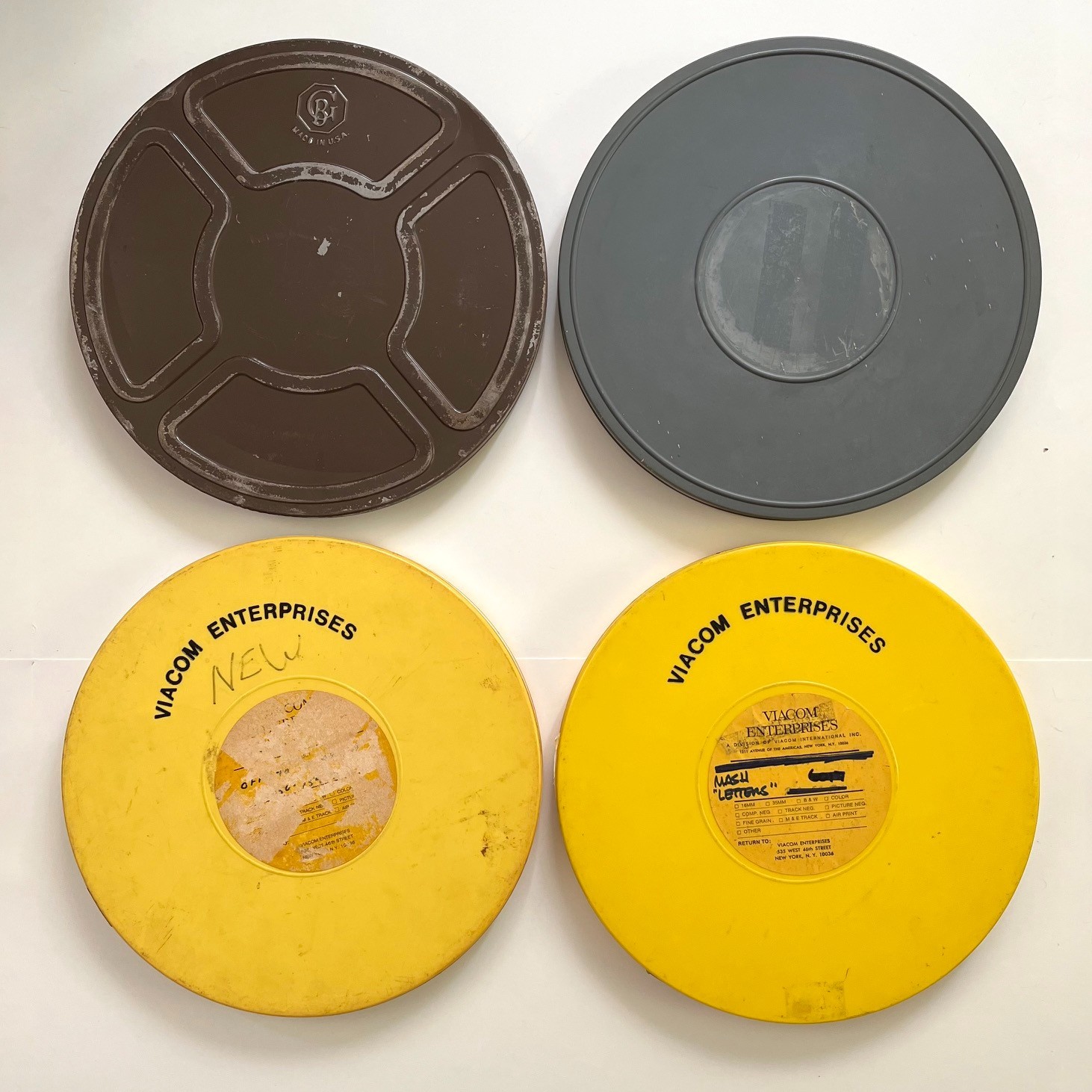 Assorted empty 1200′ 16mm Film Reels (3) and Canisters (4) incl. Fox / M*A*S*H