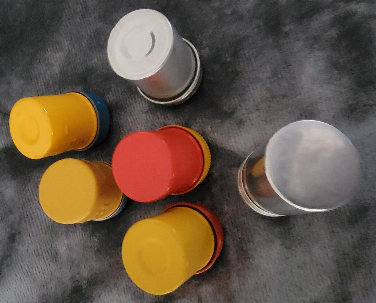 Vintage 35 mm film canisters-leather, metal and paper