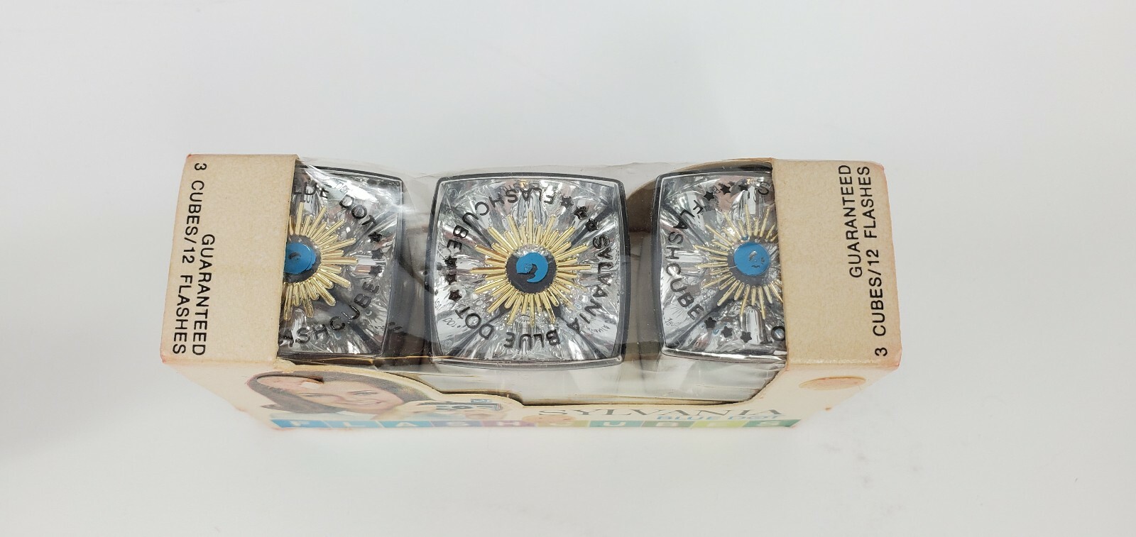 4 Camera Flash Cubes, 3 Boxes of Sylvania Blue Dot, 1 Box of Norelco NOS Bulbs