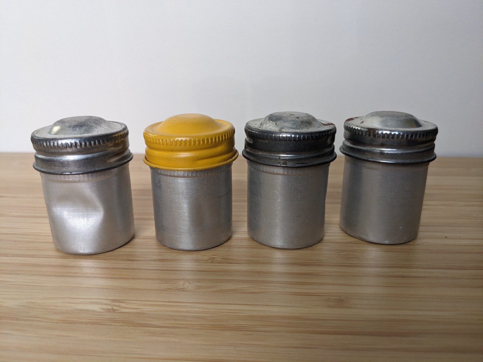 Four Vintage 35mm aluminum film canisters unbranded W/ metal top