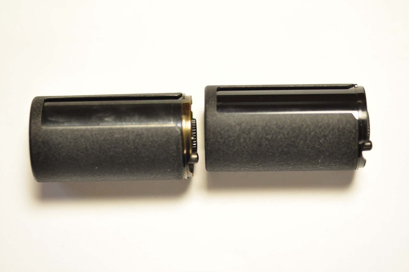 2-Nikon 35mm reloadable film cassette as shown. Two different. See images.