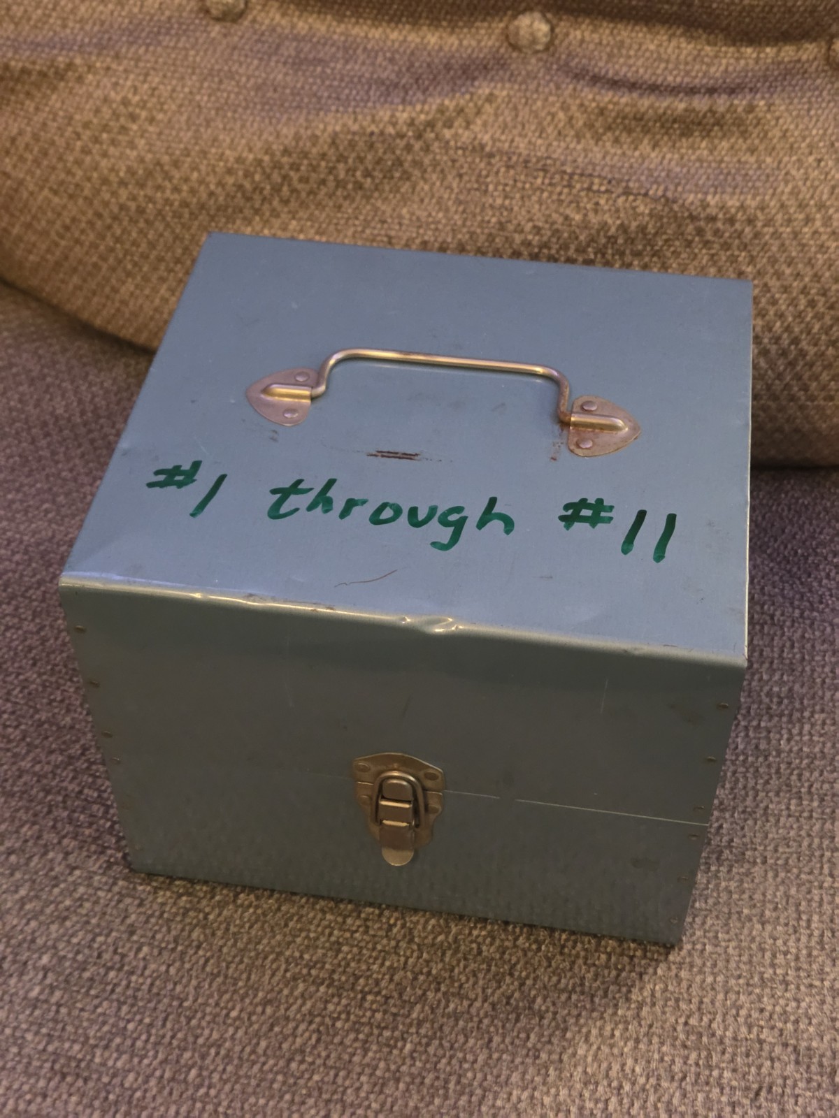 Eleven (11) 7″ Diameter Movie Reels with Metal Cans and Carrying Case