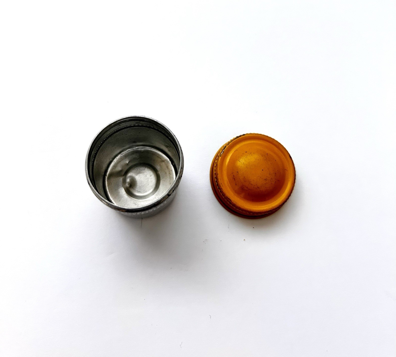 Classic Vintage 35mm aluminum film canister unbranded with metal yellow top cap