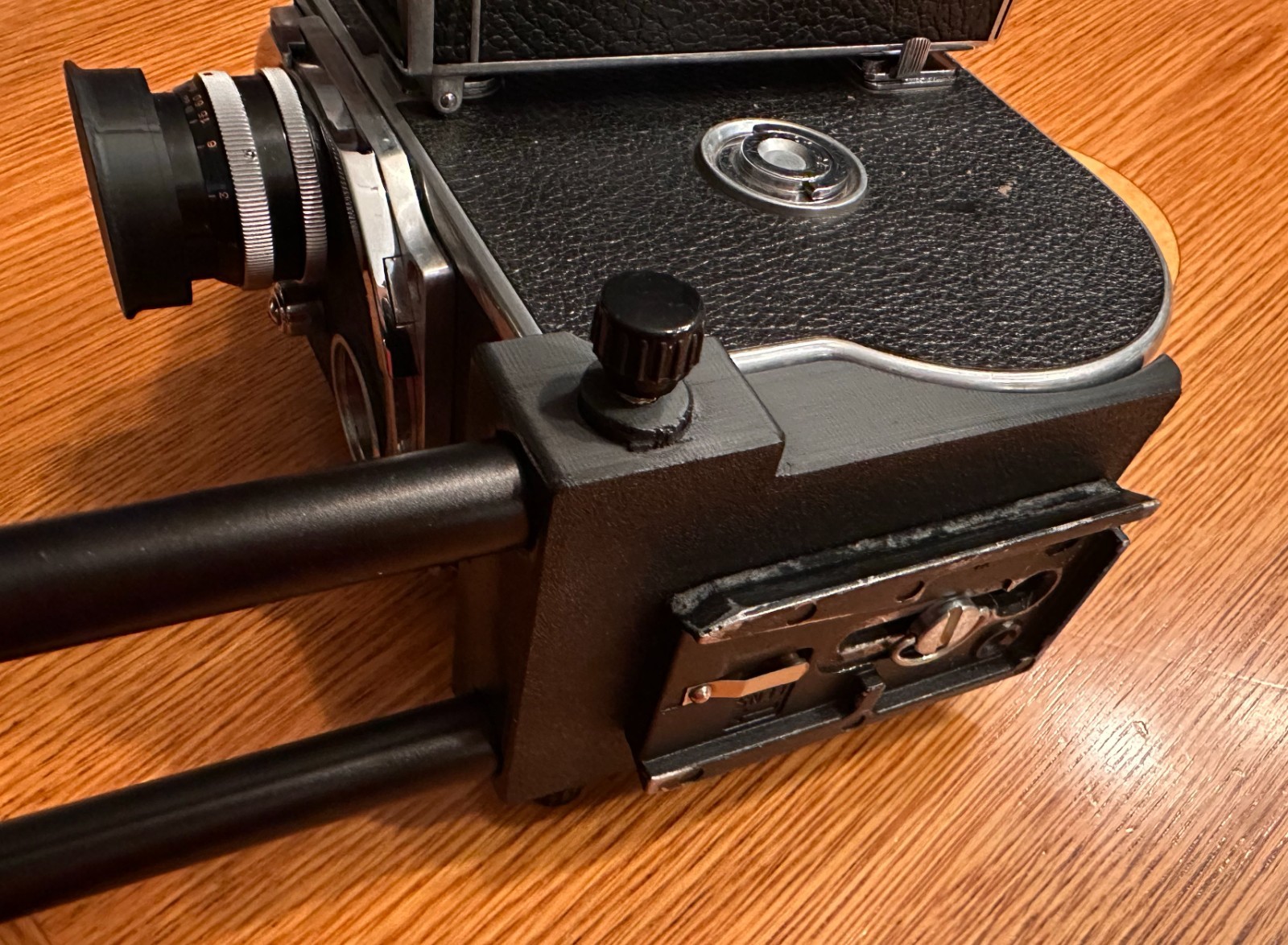 Bolex Saddle for 15mm Rods 60mm on Center – for “REX1 2 or 3” Round Base Cameras