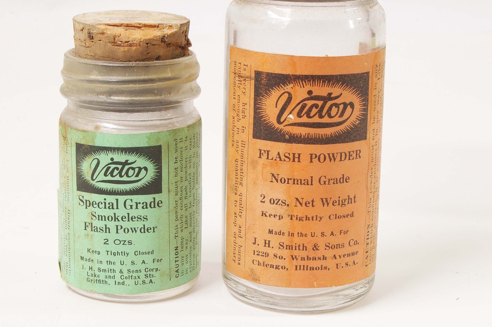 F97917~ Two Victor Flash Powder Cans With Bottles – Empty – J.H. Smith & Sons