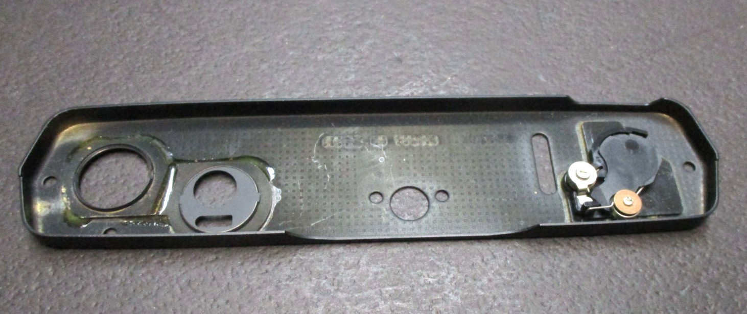 Olympus model OM-4 35mm SLR black replacement bottom cover NEW OLD STOCK