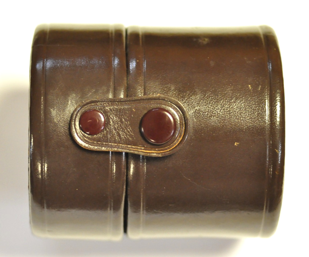 Nikon Nikkor brown leather lens case. Outside dim. 3 3/8″ D x 3 3/4″ H. READ.