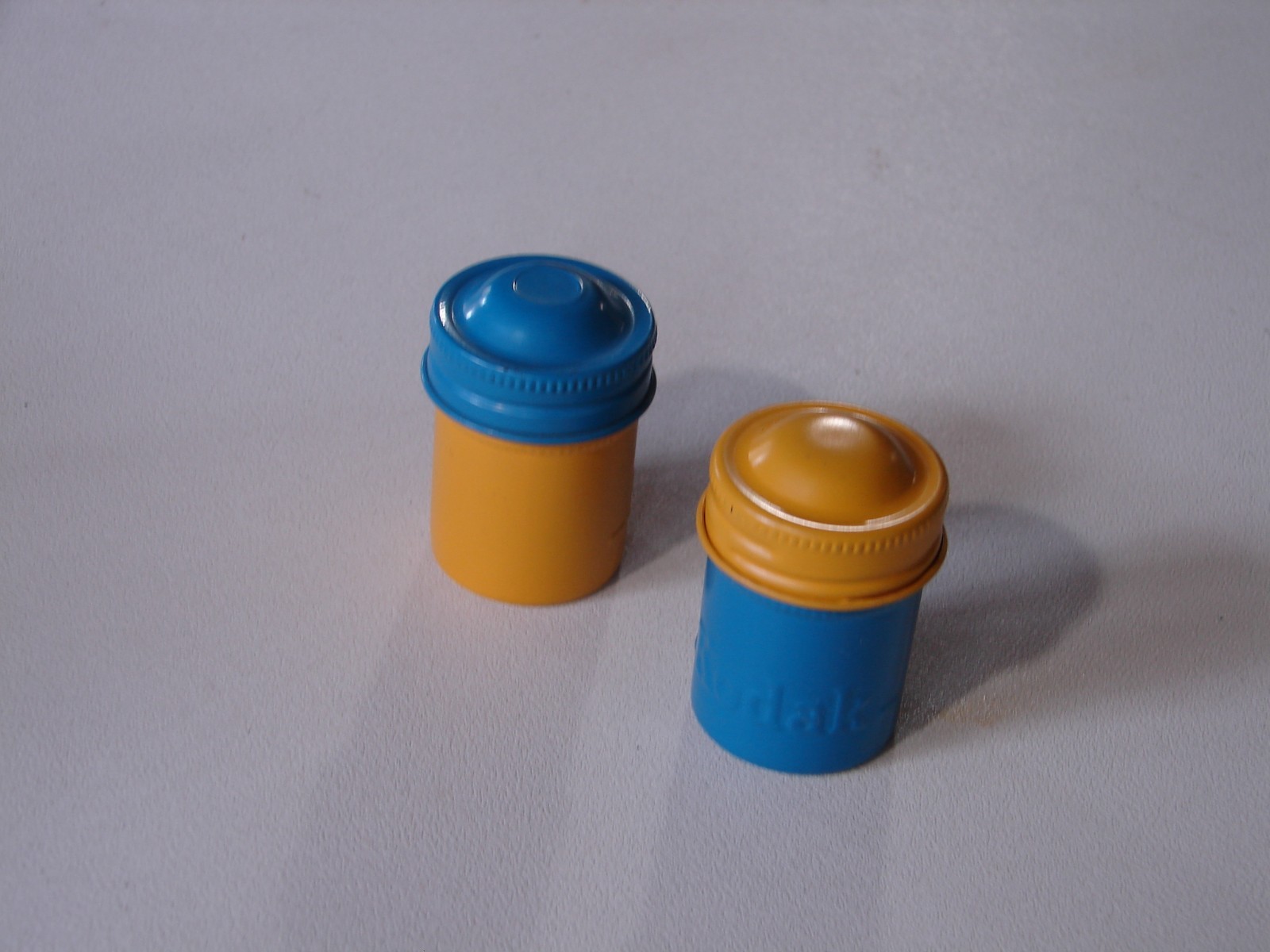 Kodak Metal Film Cannisters 1blue& yellow top & 1 yellow& blue top. Used VF cond