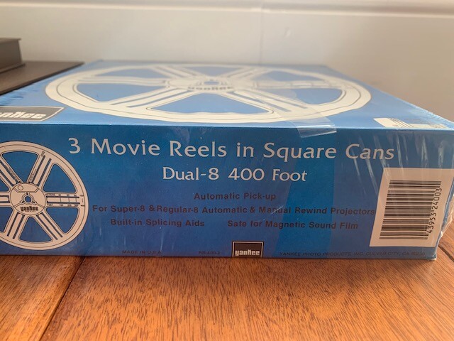 Lot of Vintage 7 Inch 8mm Metal and Plastic Film Reels, Cans, and Movies