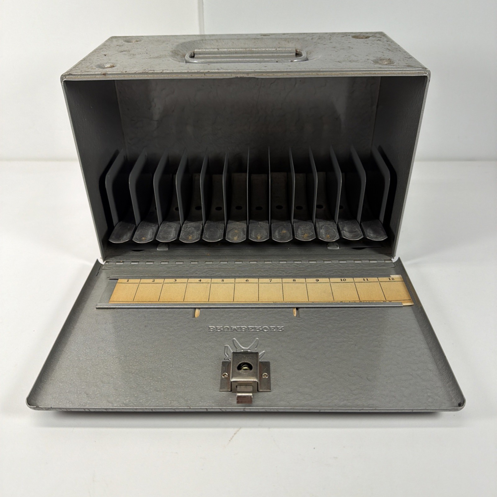 Vintage Brumberger 12 slot- 8mm Film Reel Case Metal Box 1950’s w/ Advertising