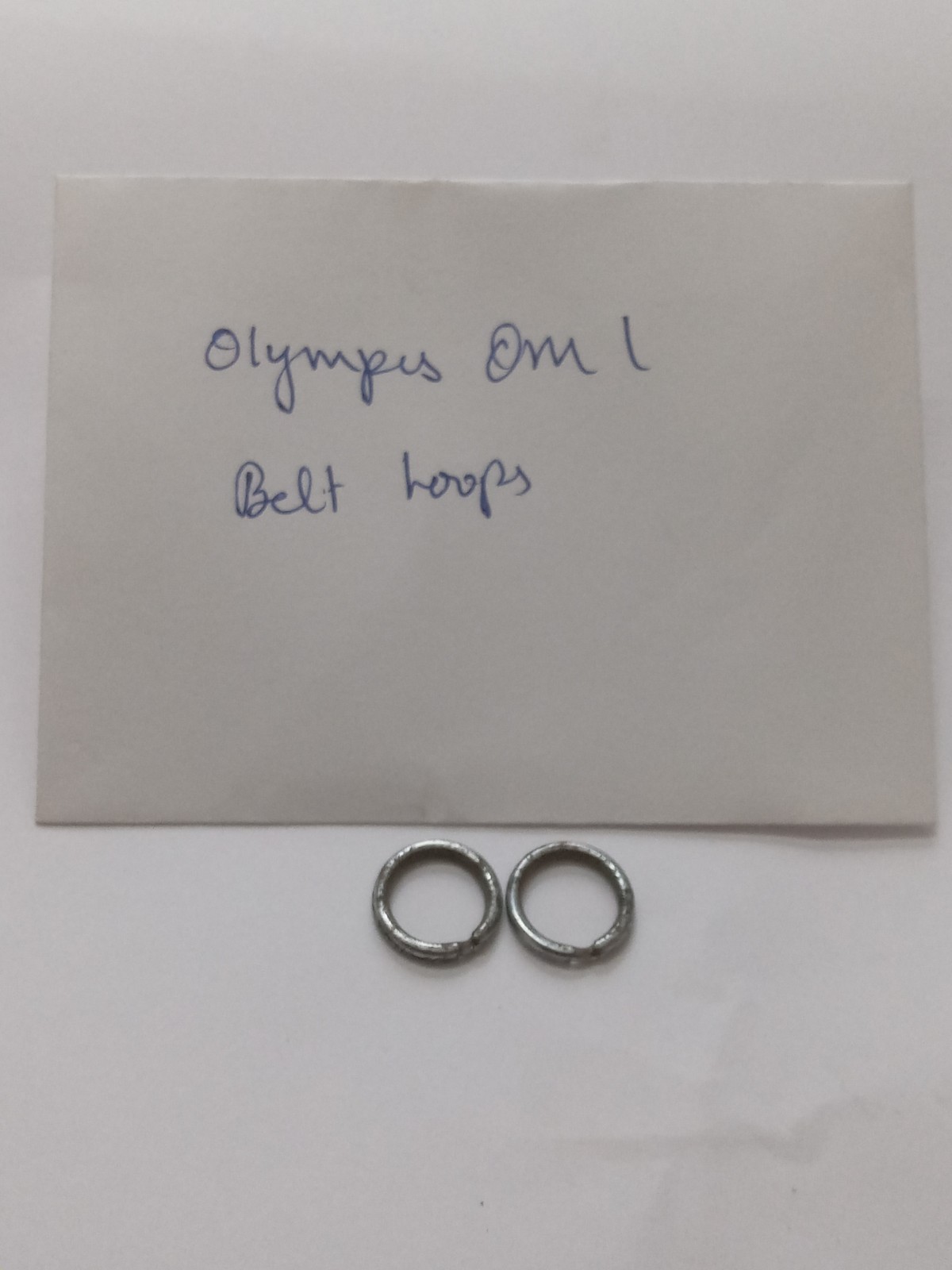 Olympus OM 1 Black Camera Belt/ Strap Loops Original Used Spare Part.