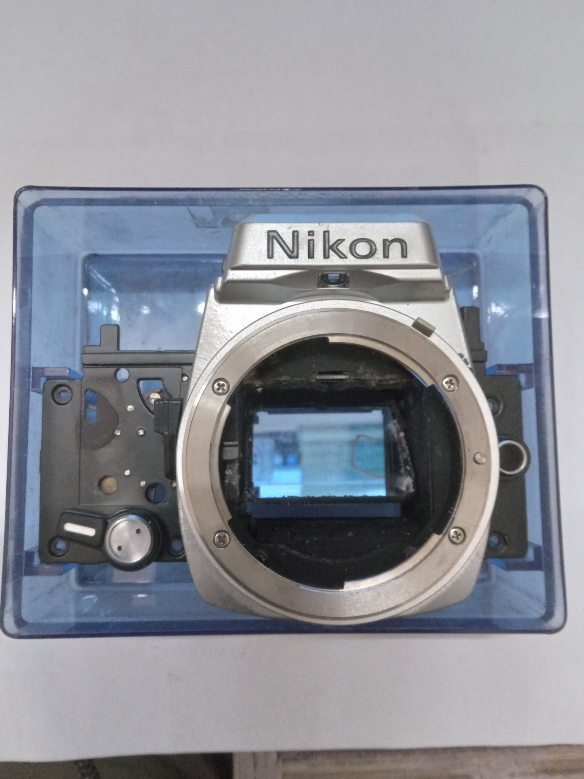 New Old Stock Silver / Chrome Nikon FE Front Bezel W Mirror Spare Part