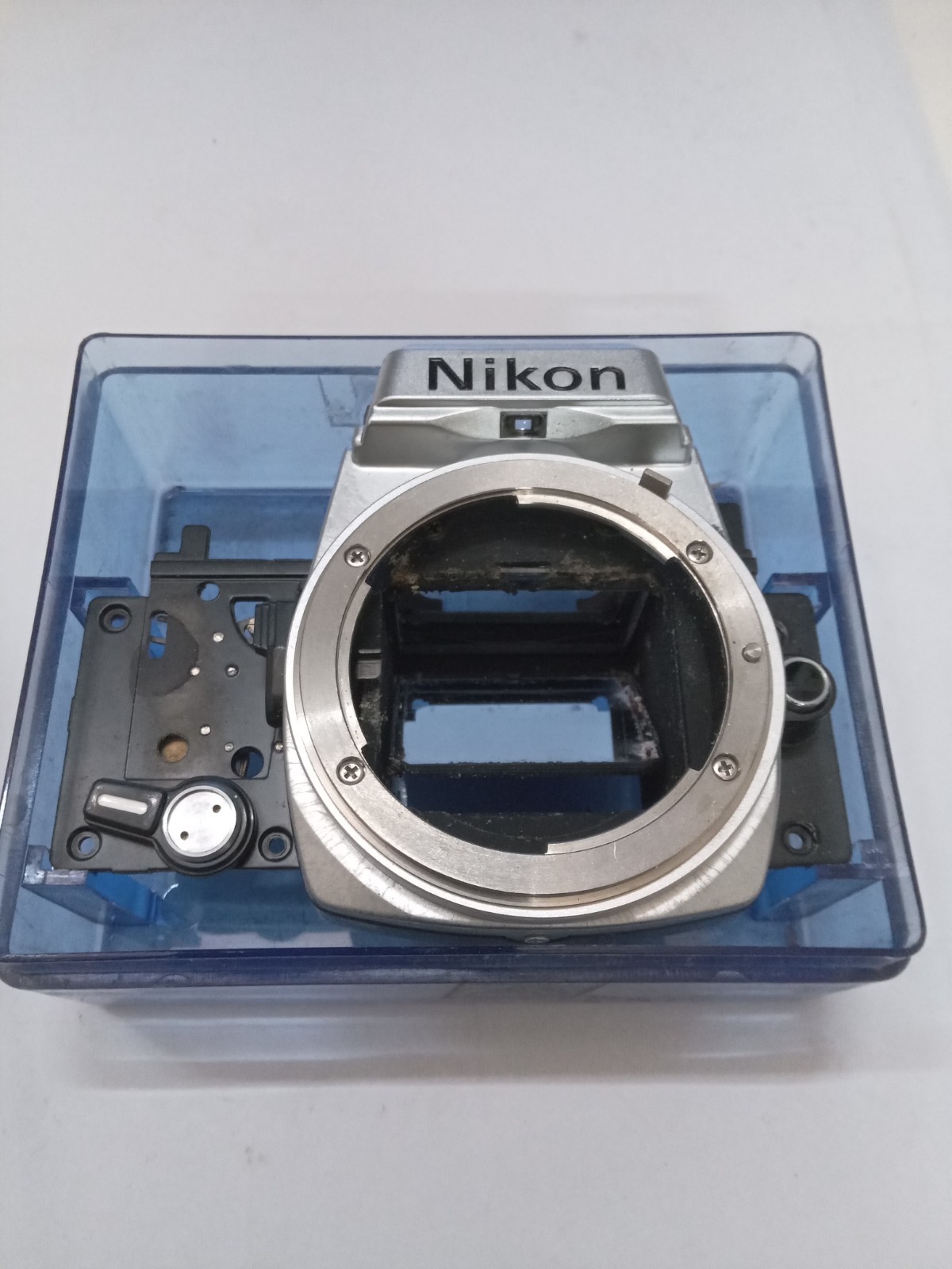 New Old Stock Silver / Chrome Nikon FE Front Bezel W Mirror Spare Part