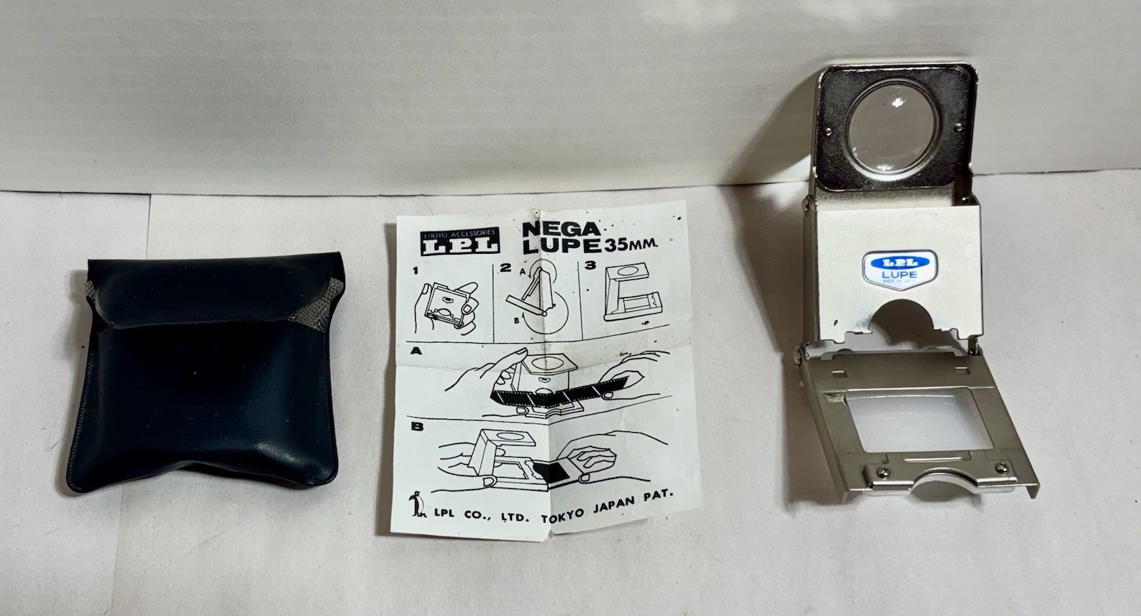 LPL NEGA LUPE Metal Folding Loupe for 35mm Negatives with Pouch & Instructions