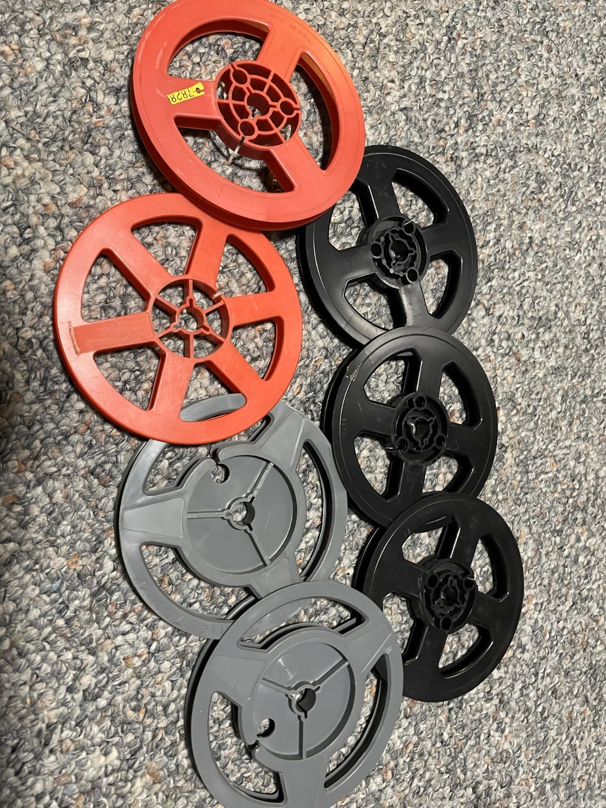 Seven plastic 200 feet Super 8 movie reels.