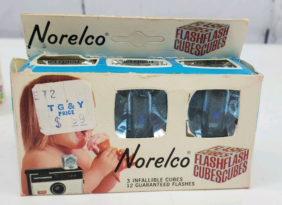 4 Camera Flash Cubes, 3 Boxes of Sylvania Blue Dot, 1 Box of Norelco NOS Bulbs