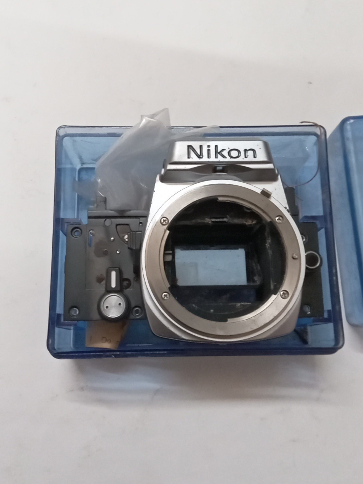 New Old Stock Nikon FM / FE Silver Front Bezel W Mirror Box Spare Part