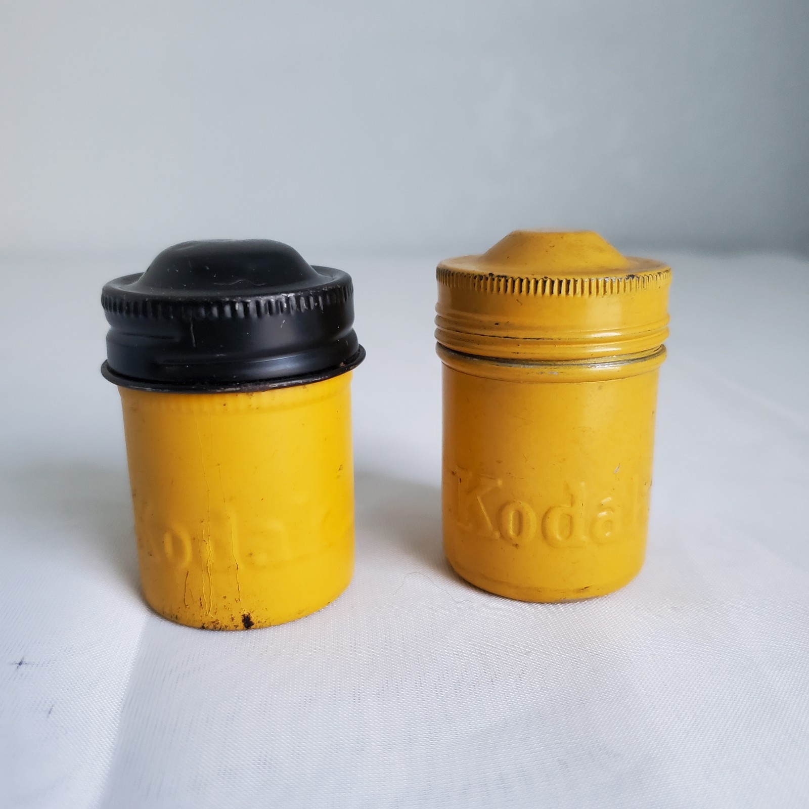 Lot of 2 Kodak Black Yellow Embossed Metal Film Roll Containers