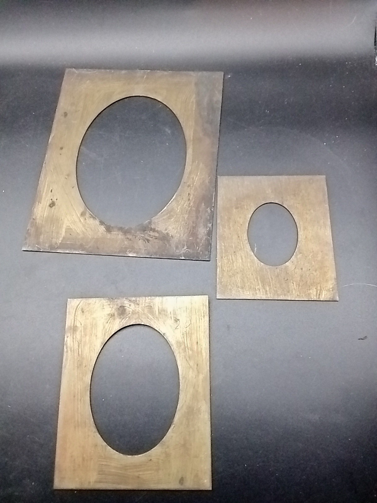 A Lot Of Three Brass Photo Masking Mats With An Oval Opening