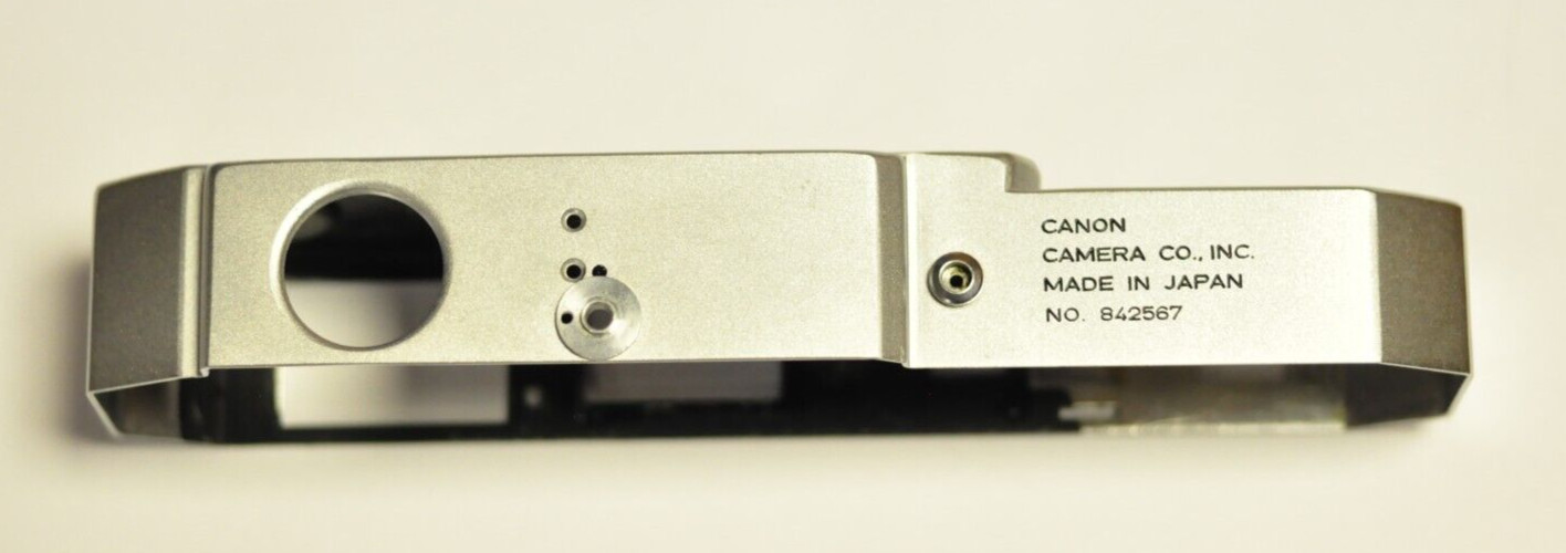 Bell & Howell/Canon model 7 35mm rfdr. silver repl. top cover. Nos. READ. I
