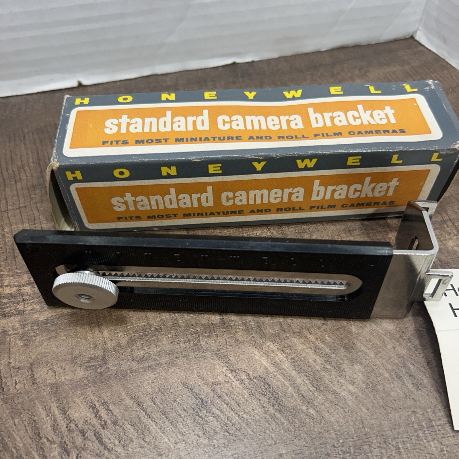 Lot of 3 Vintage camera accessories, 2 camera brackets & 1 angle blow brush